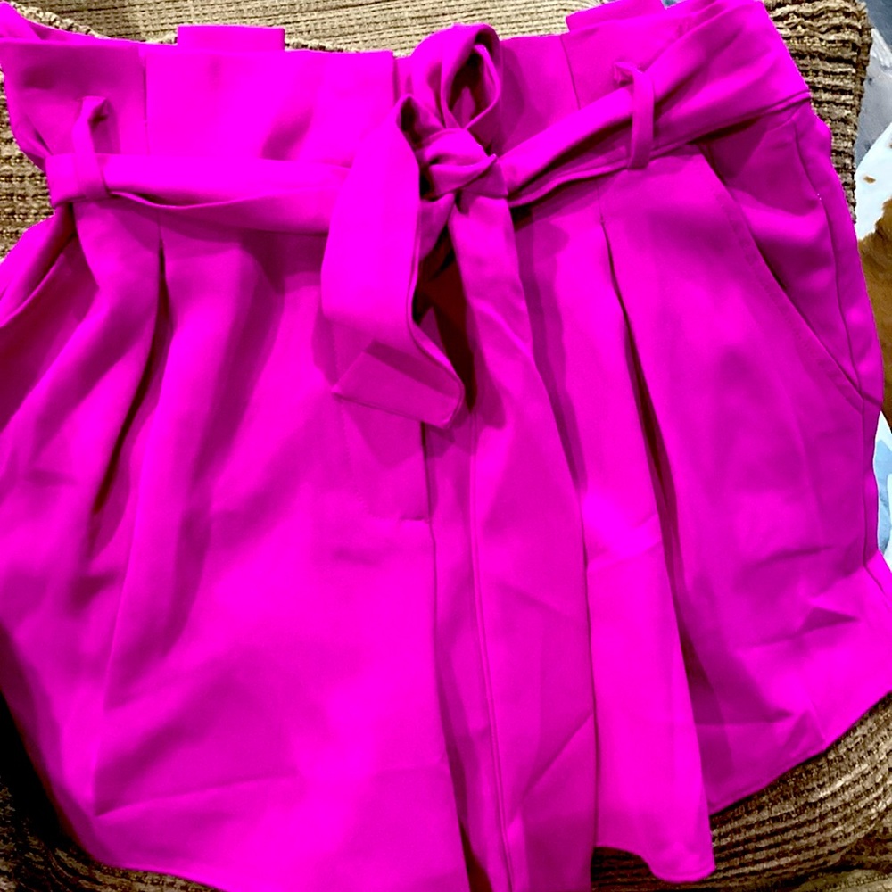 Pants store womens magenta pleated dress shorts.